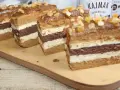 Pyszne ciasto toffi z masą kajmakową, przełożone czekoladowym biszkoptem i kremem. Udekorowane kandyzowanymi skórkami.